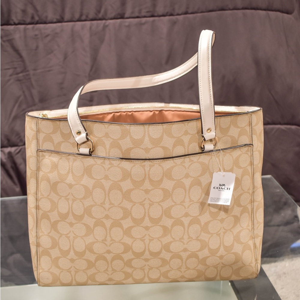 Brand new with tags tan Coach purse!